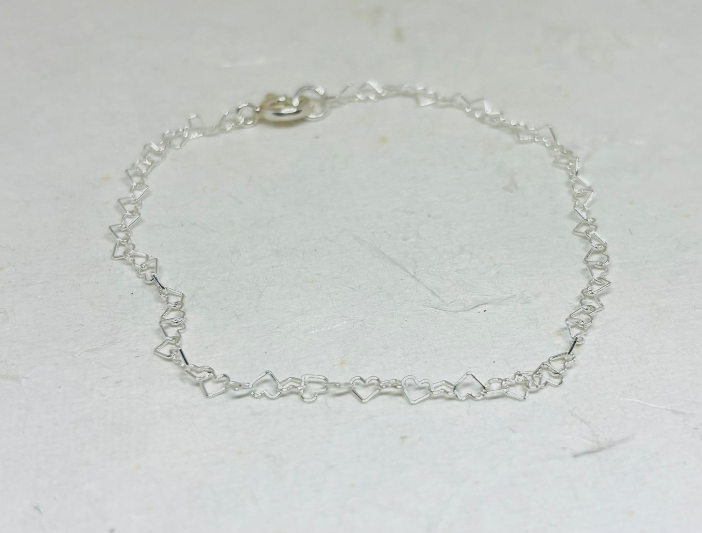 Zilveren hartjes schakel armbandje